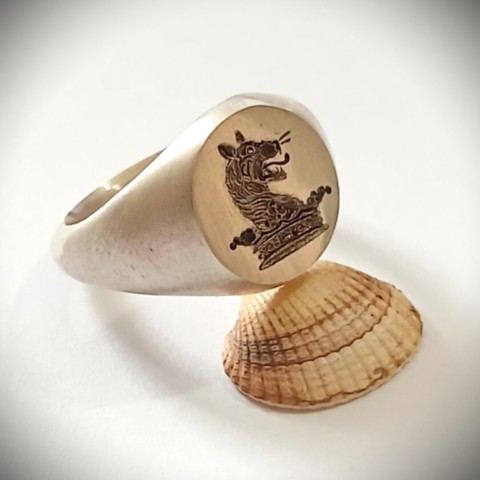 Crest engraved silver signet ring prior to finishing and polishing